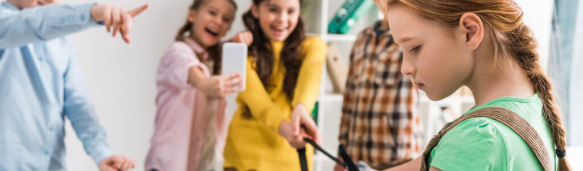 Panoramic,Shot,Of,Schoolkids,Bullying,Schoolgirl,In,Classroom