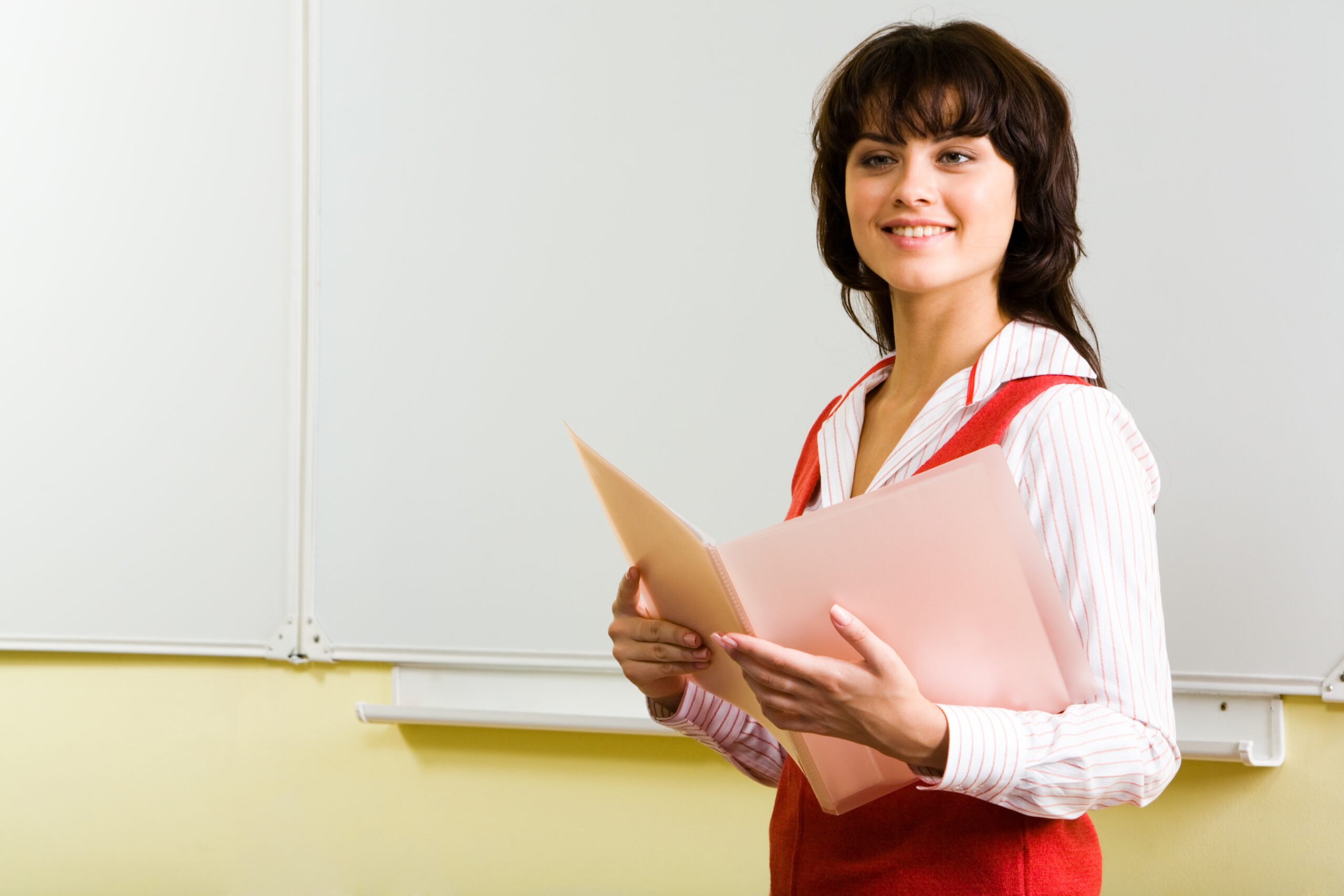 Photo,Of,Smiling,Teenager,With,Folder,In,Hands,And,Whiteboard