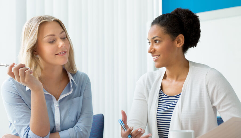 Two,Women,Working,Together,In,Office
