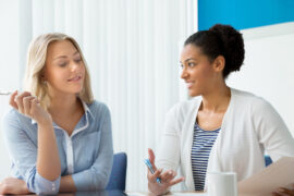 Two,Women,Working,Together,In,Office