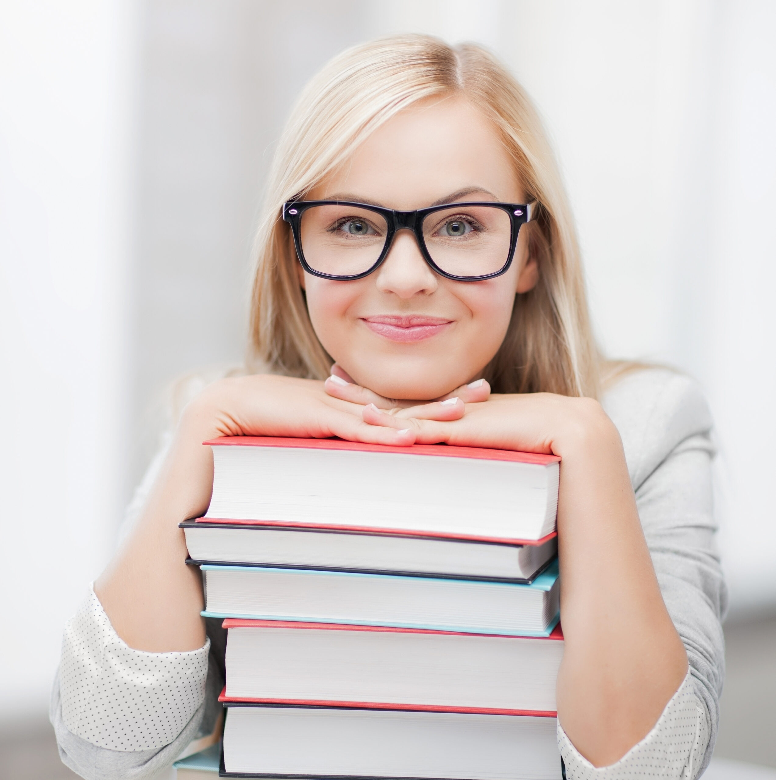 Picture,Of,Smiling,Student,With,Stack,Of,Books