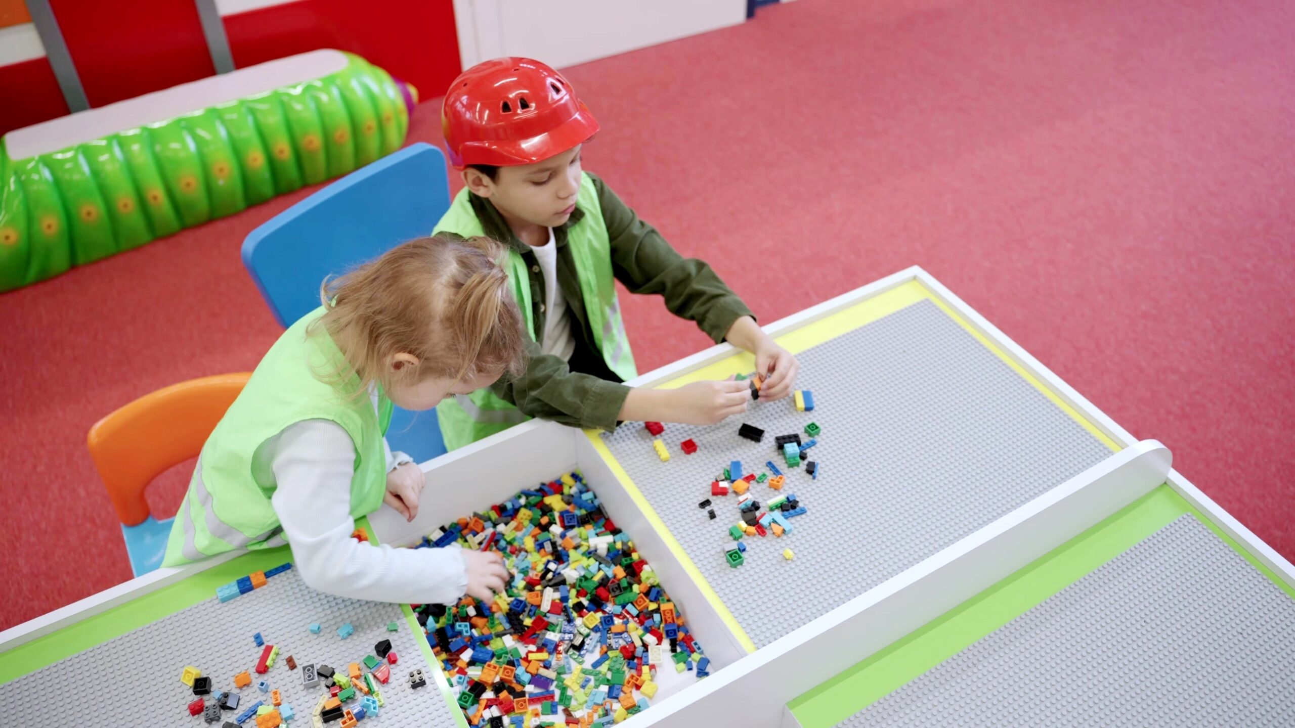 Joyful,Children,Wearing,Waistcoats,Building,With,Colorful,Blocks,Together,In