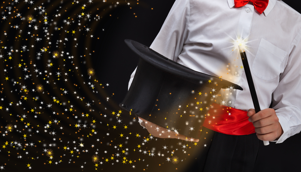 Magician,Hands,With,Magic,Wand,Conjuring,Sparkling,Stars,Stream,
