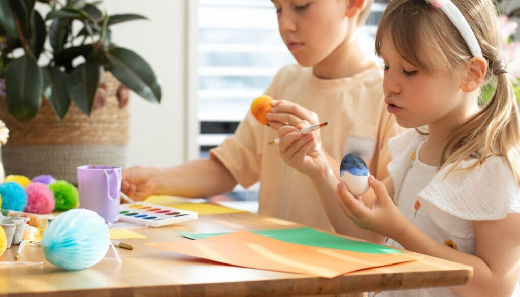 Children,Enjoy,Doing,Easter,Crafts,By,Painting,Eggs,Indoors.,Brother